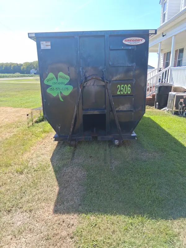 Irish Greens container 2506 on the lawn beside a farmhouse porch